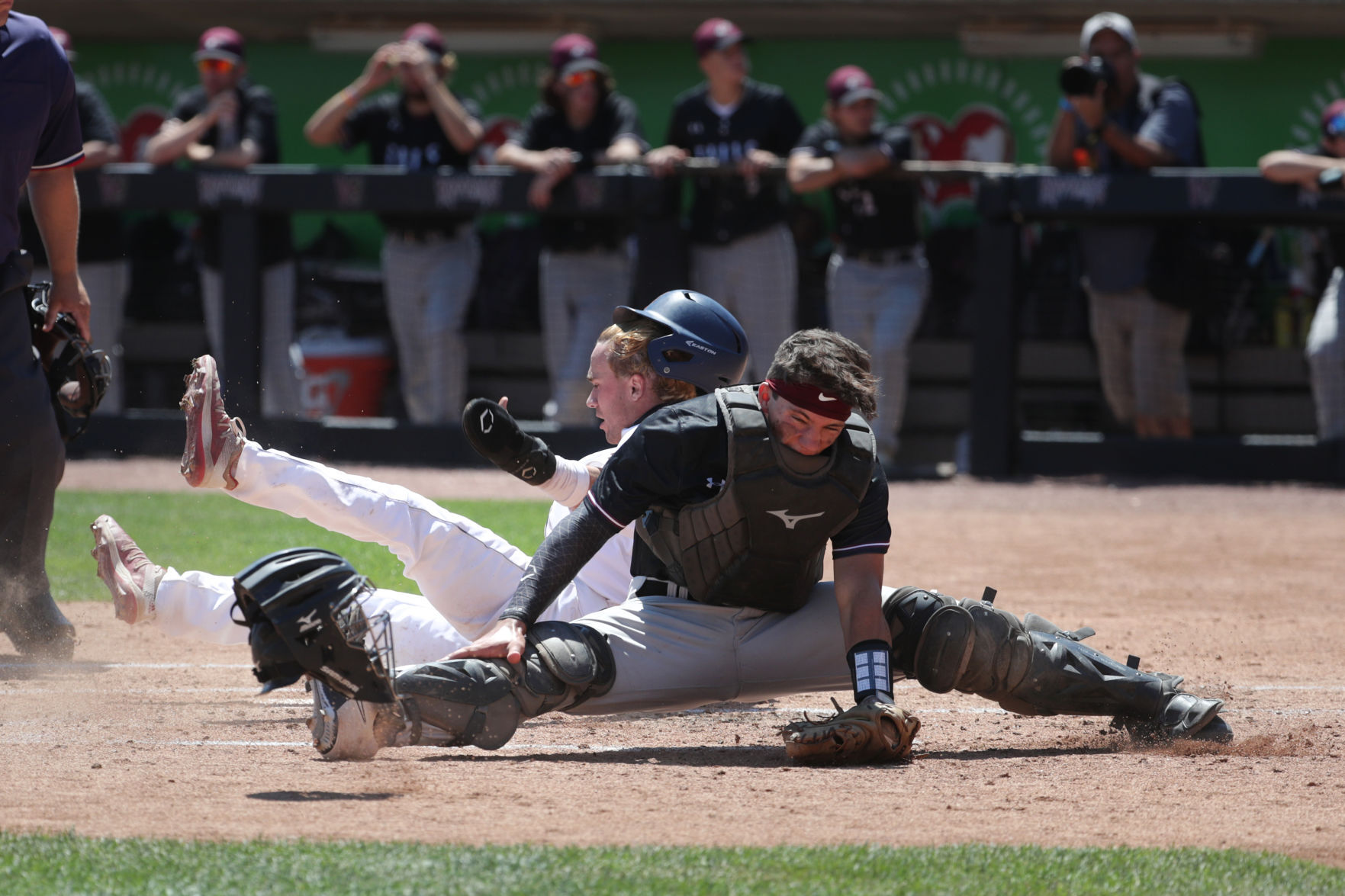 WIAA state baseball photo: Carson Shepard of Sun Prairie gets into a collision at home plate